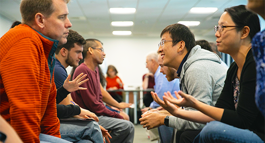 Participants in two rows in conversation