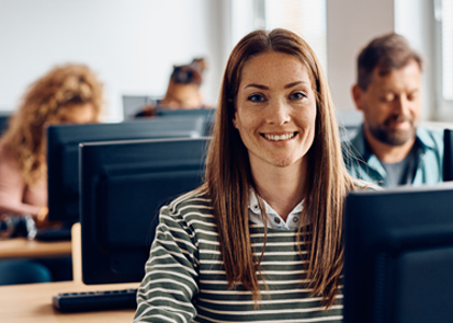 Woman in classroom of test-takers