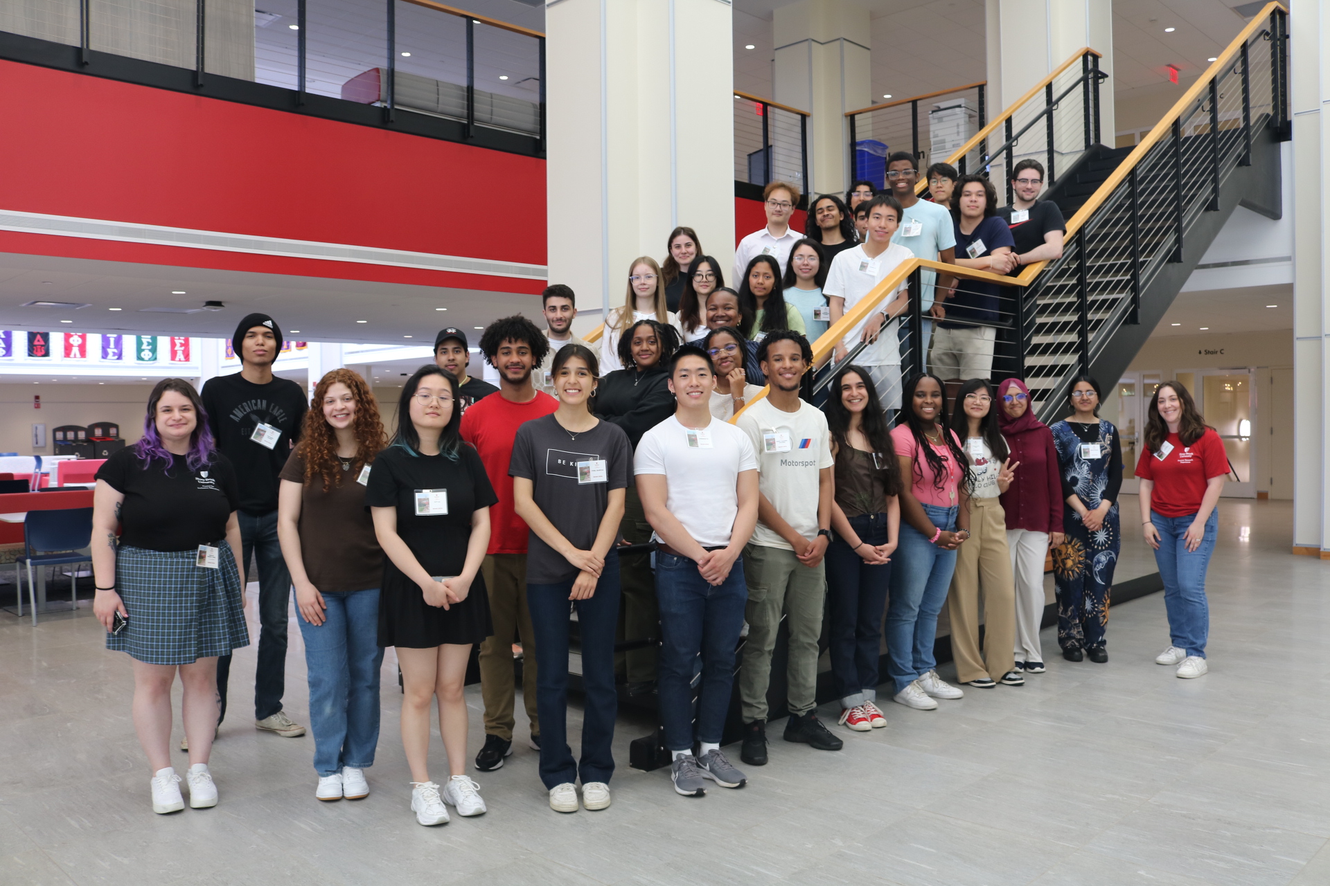 Group photo of 2024 SOAR students and staff along staircase