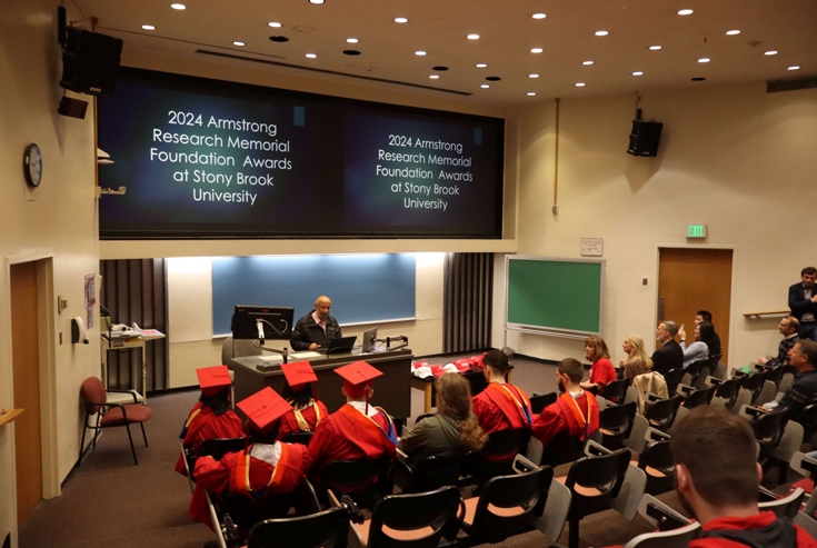 Prof. Jayant Parekh presenting a talk on Armstrong's life and genius