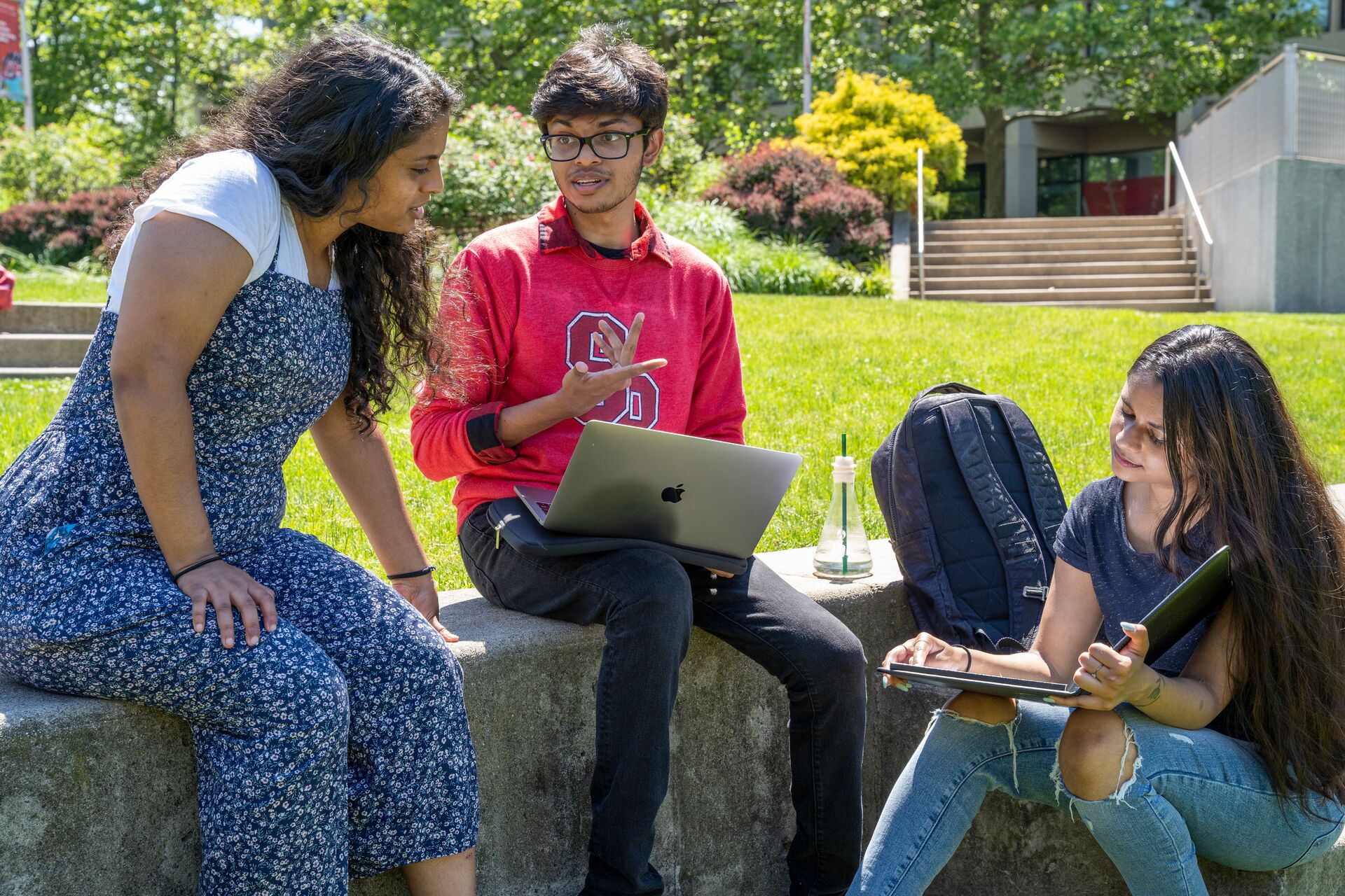 Students sitting and talking on campus
