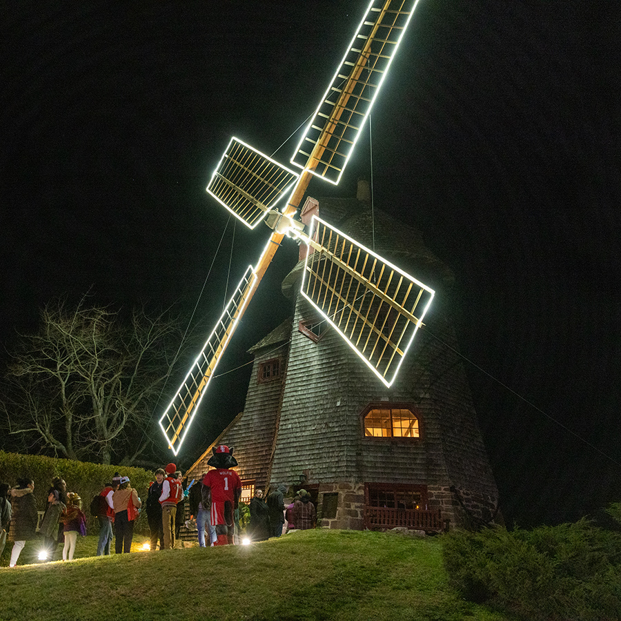 image of stony brook windmill lit up at night