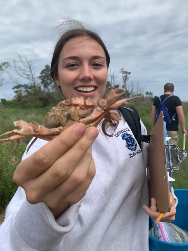 Ellie Evans holds a crab