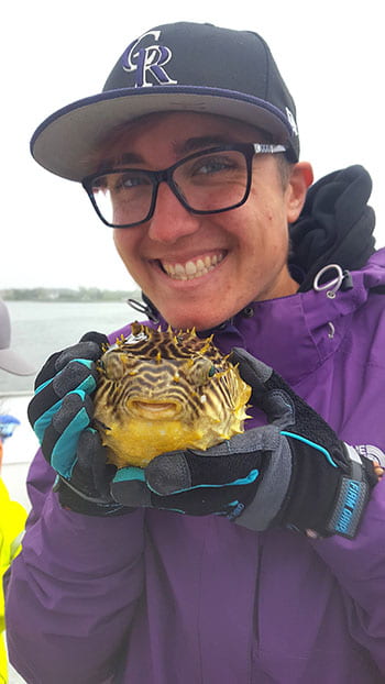Lucy with a burrfish retrieved from Quantuck Bay.
